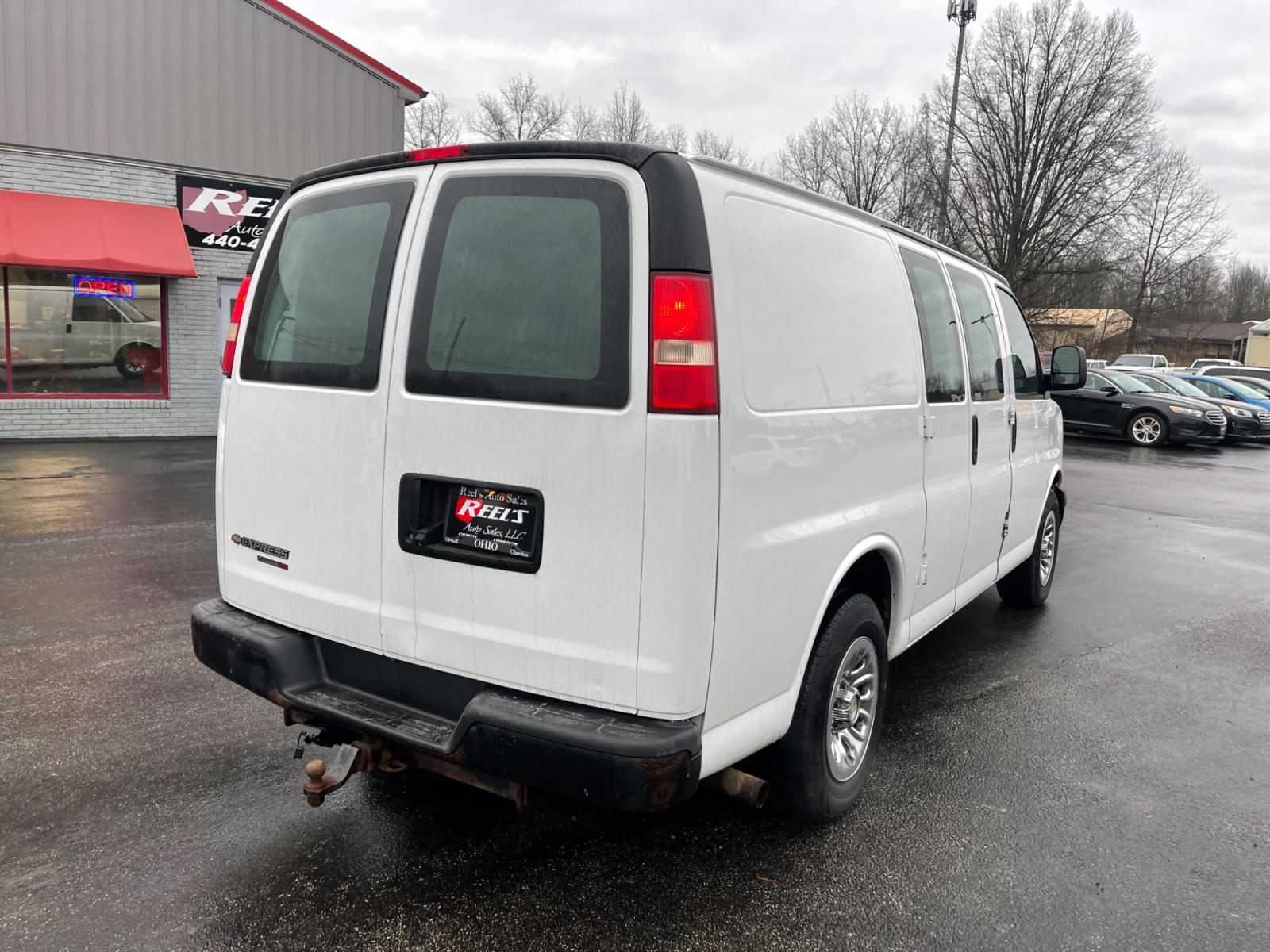 2014 White /Neutral Chevrolet Express 1500 AWD Cargo (1GCSHAF4XE1) with an 5.3L V8 OHV 16V FFV engine, 4-Speed Automatic transmission, located at 547 E. Main St., Orwell, OH, 44076, (440) 437-5893, 41.535435, -80.847855 - This 2014 Chevrolet Express 1500 Cargo Van with a 5.3L Vortec V8 engine and all-wheel drive is a versatile and robust vehicle designed to meet various transportation and towing needs. It comes equipped with convenient features such as power windows, power locks, and a backup camera for safer reversi - Photo #7